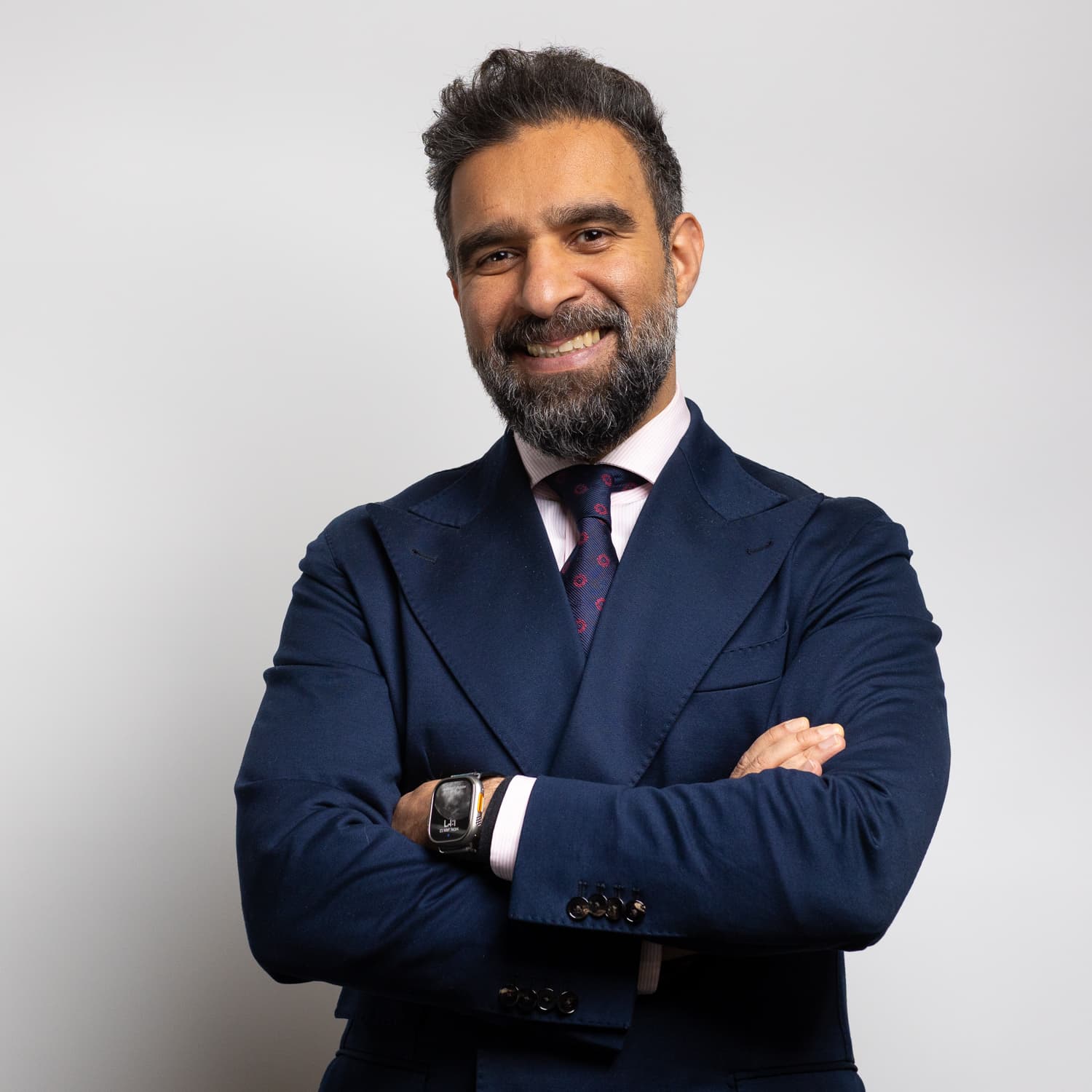 Prof. Mohammad H. Jamal, arms crossed, light background