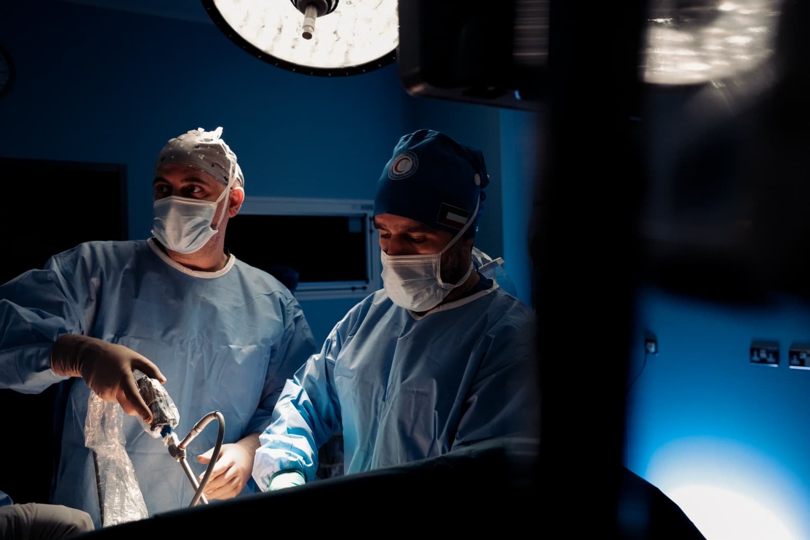 Surgical team preparing instruments in theatre